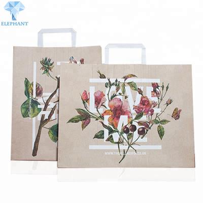 China Matt Varnish Ribbon Handle Gift Bags CCNB Brown Paper Party Bags for sale