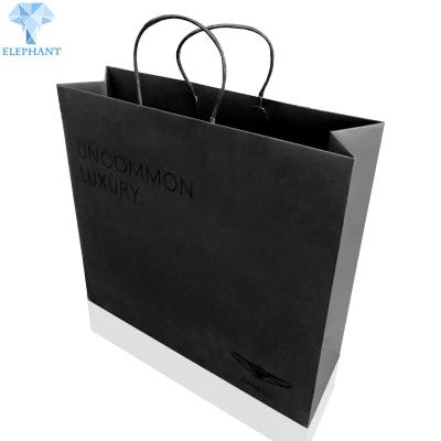 China Heavy Duty Printed Paper Carrier Bags 20×21×8cm Matte Black Gift Bags for sale