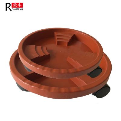 中国 ブラウン色の車輪が付いているプラスチック植木鉢の受皿の植物の鍋水皿 販売のため