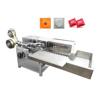 China PLC Automatic Packing Machinery Pillow or Condom Packing Machine for sale