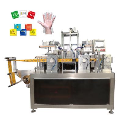 China Automatic Packaging Folding And Sealing Machine For Disposable Gloves for sale