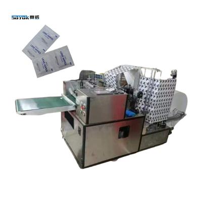 China Máquina de produção de limpeza de lentes de aço inoxidável de qualidade de álcool Máquina de embalagem de selos de quatro lados à venda