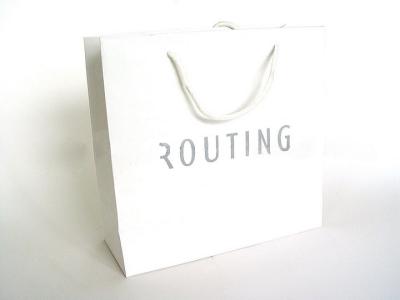 China Custom Recycling White Paper Shopping Bags with Handles for sale