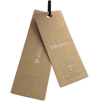 China Custom Printed Brown Texture Paper Luggage Tags Gold Foil Stamping Logo Supplier for sale