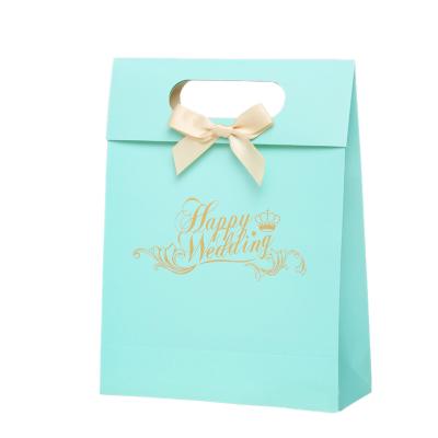 China Hot Sell Printed Small Paper Sweet Bags Candy Packaging With Die Cutting Handle for sale