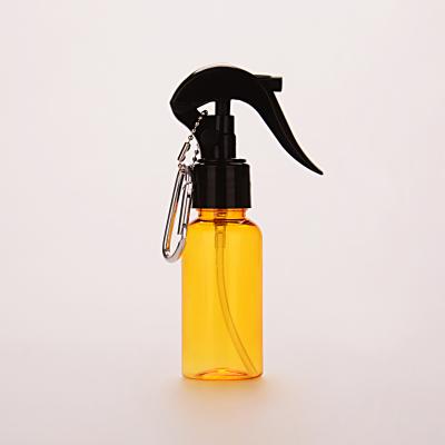 China 3oz Amber 50ml Round Pet Plastic Trigger Spray Bottle With Keychain Easy Take for sale