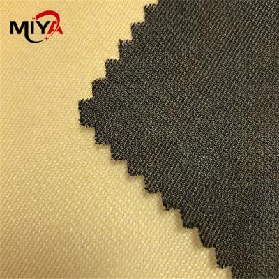 China Tela adhesiva de fusión tejida elástico 100% de la prenda impermeable del poliéster que interlinea en venta
