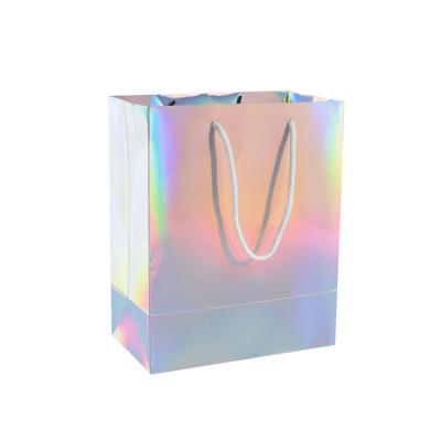 China Cheap Custom Size Fashionable Laser Holographic Paper Bag Ribbon Colorful Shopping Paper Bag with LOGO Printing for sale