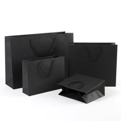 China Black Shopping Kraft Customized Paper Bags Logo Printing Wholesale With Ribbon Handle for sale