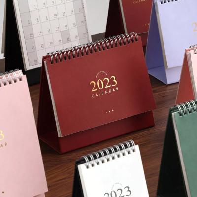 China Calendario al por mayor de impresión de encargo 2023 del calendario 365 de la tabla del escritorio del tirón en venta