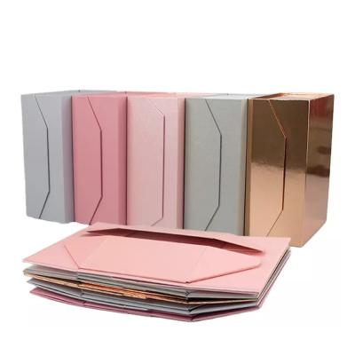 China Custom Logo Wedding Dress Rigid Magnetic Folding Cardboard Packaging Paper Gift Box With Ribbon Closure for sale