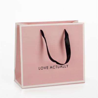 China Personalised Pink Branded Paper Gift Bags With Black Ribbon Handles for sale