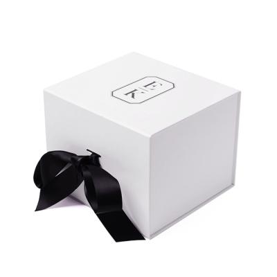 China Custom White Magnetic Folding Rigid Boxes With Ribbon For Gift Packaging for sale