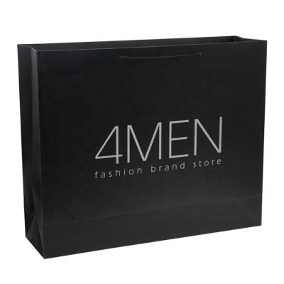 China Custom Matt Lamination Luxury Black Packaging Paper Bags For Clothes Packaging for sale