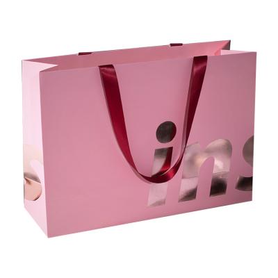 China Custom Printing Branded Logo Retail Paper Shopping Bags With Ribbon Handles for sale