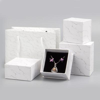 China logotipo personalizado que imprime o empacotamento de mármore da caixa de presente da joia do botão de punho do broche do pendente à venda