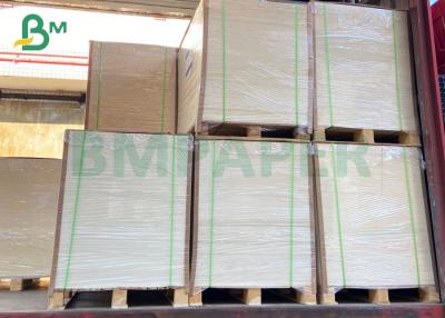 China Virgin Pulp 300g 325g C1S Coated Kraft Back Paperboard For food packaging box for sale