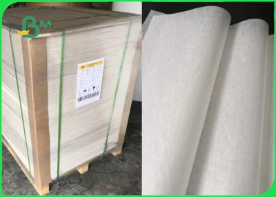 China El papel blanco impermeable a la grasa del trazador de líneas de la magdalena para la cocina de la panadería equipa 31 - 38gsm en venta