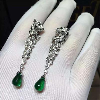 China C Cheetah Earrings - showing the charm of courage, naughty or docile .310 round bright cut diamonds, emerald and onyx. for sale