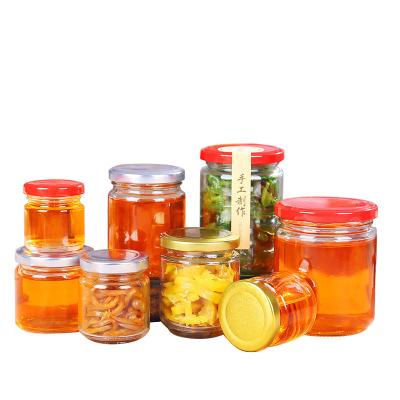 China Lead Free Seal Label Glass Honey Jar With Tin Lid Food Grade Round Shape for sale