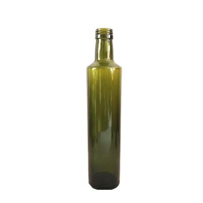 China La botella de cristal verde oscuro ambarina del aceite de oliva redonda/cuadrado formó fácil de utilizar en venta