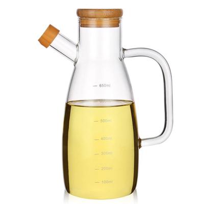 China Clear 650ml Glass Olive Oil Bottle With Bamboo Lid for sale