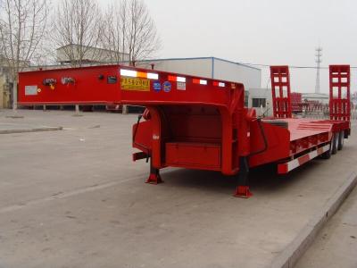 China 3 Axle Low Bed Semi Trailer Red Color With Self Steering Axles And Hydraulic Ramps for sale