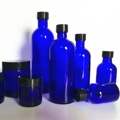 China Eco Friendly 30ml Glass Boston Bottles Purple With Screw Caps for sale