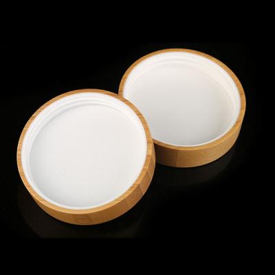 China Tarro poner crema plástico de diversos tamaños con la tapa de bambú en venta