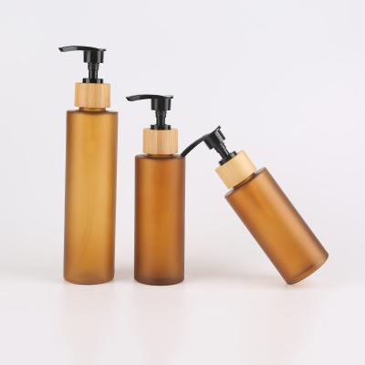 China 120ml 250ml Bamboo PP Amber Frosted Lotion Bottle for sale