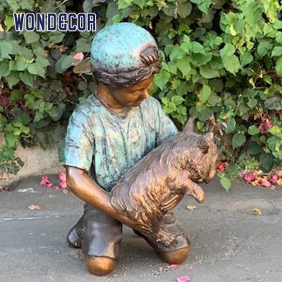 China Customized garden decoration, life-size bronze statue of a young man playing with his dog for sale
