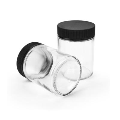 China Child Resistant 4 Oz Glass Bottle Different Size Glass Jar With Black Lid for sale