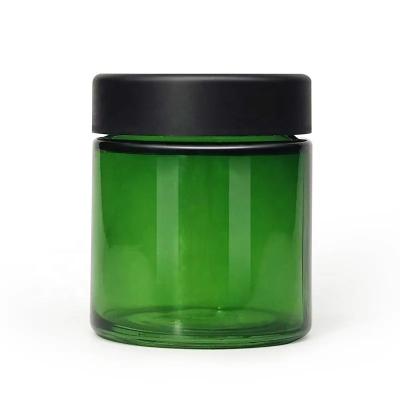 China Custom Green Glass Jars Childproof Smell Proof Matte Black Smooth Plastic Lid for sale