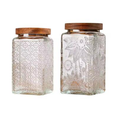 China Retro Embossed 500ml 1L Square Airtight Storage Jar Sealed Glass Container With Acacia Wooden Lid for sale
