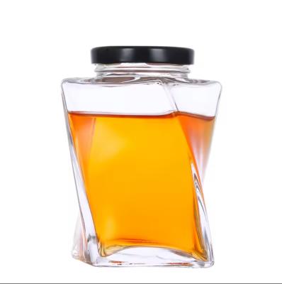 China 360ml Custom Clear Twist Shape Honey Glass Bottle Unique Honey Jars With Metal Cap for sale