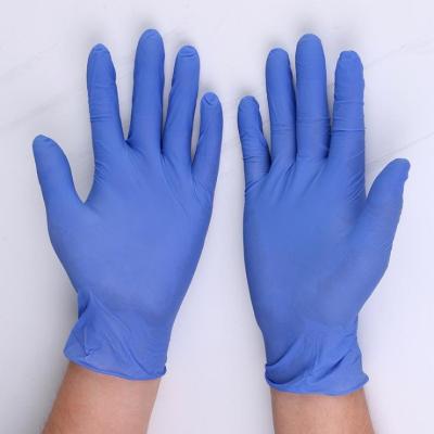 China Luvas azuis adultas médicas do nitrilo dos artigos EN374 consumíveis à venda