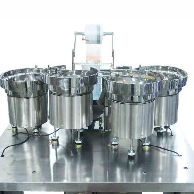 China Four Vibrator Bowl Automated Packaging Machine Four Tray Auto Packing Machine for sale