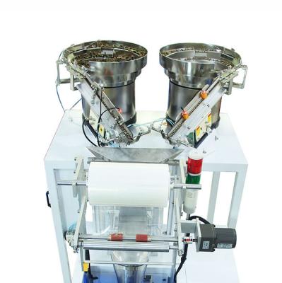 China Weighing Screening Screw Packaging Machine With Two Vibrating Plates for sale