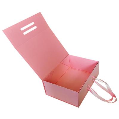 China Pink Folding Rigid Gift Box Cosmetic Paper Packaging Corrugated Cardboard Christmas Paper Box en venta