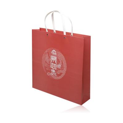 中国 Biodegradable Gift Packing Paper Bag Custom Design Personalized Red Paper Bags With Handle 販売のため