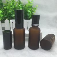 China Frosted Glass Cosmetic Bottle 30ml Transparent Amber Bottles With Pump for sale