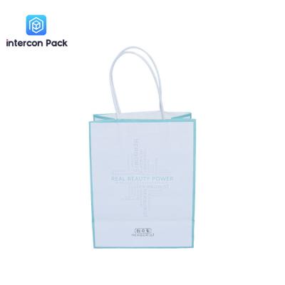 China Gift Package White Kraft Shopping Bags Glossy Lamination Custom Logo for sale