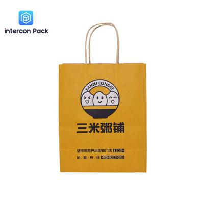 China Customized Kraft Paper Shopping Bags Brown Color Take Away Food Bag for sale