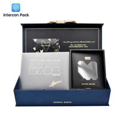 China Cardboard Luxury Gift Packaging Boxes Clamshell With Ribbon Closure for sale