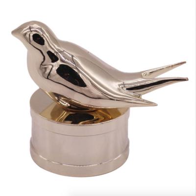 China Customized Luxury Bird Design Gold Plating perfume bottle tops Free Sample for sale
