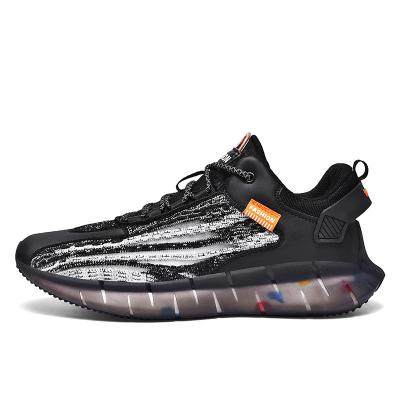 China Men Sports Workout Running Shoes Knitted Upper Reflective Sneakers à venda