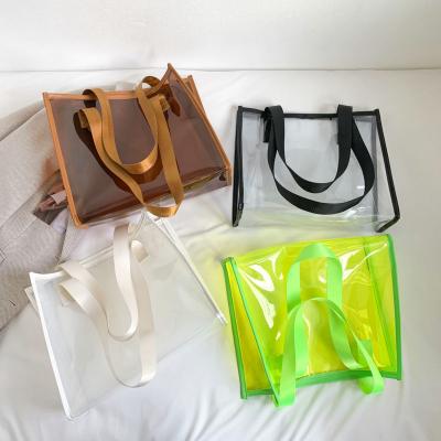China Transparent Large Bag Ladies Portable Color Ins Candy Color Laser Large Capacity Environmental Protection Shopping Bag for sale