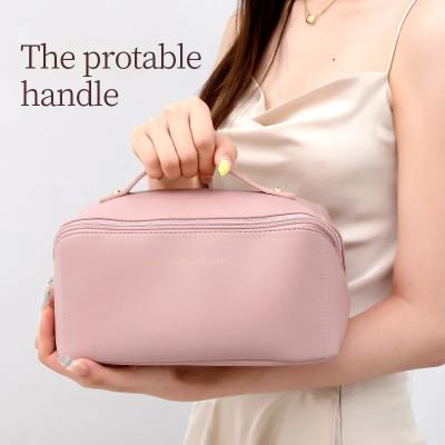 China Large Capacity Travel Cosmetic Bags Multifunctional Storage Makeup Bag PU Leather Makeup Bag for sale