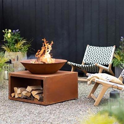 China Outdoor Wood Burning Metal Bonfire Pit Corten Steel Fireplace With Log Grate for sale