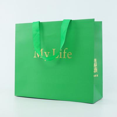 China Luxury Gift Custom Logo Paper Bag With Rope Handle for sale